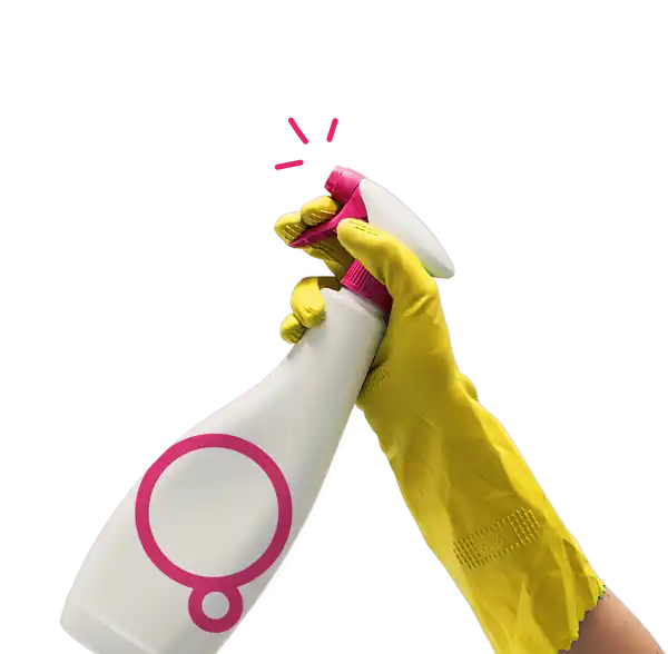 Hand holding cleaning spray bottle
